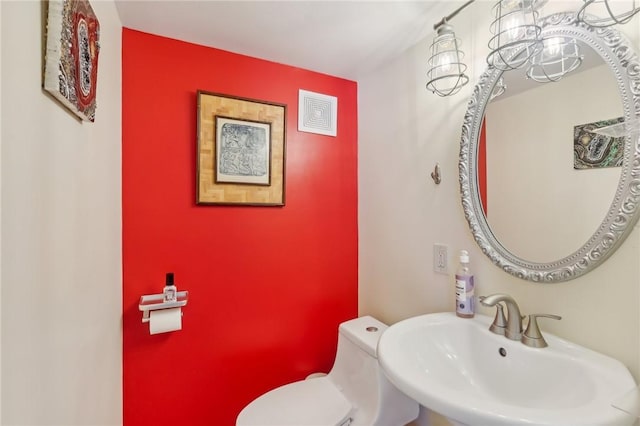 bathroom with sink and toilet