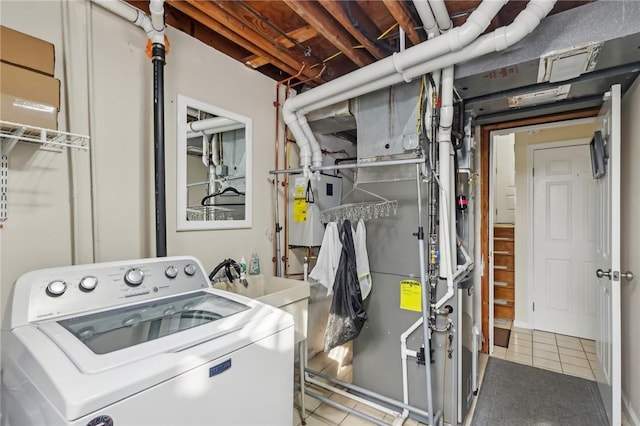 washroom featuring tile patterned flooring and washer / dryer