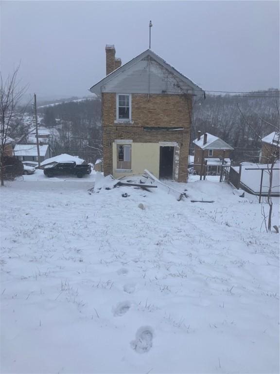 view of snow covered property