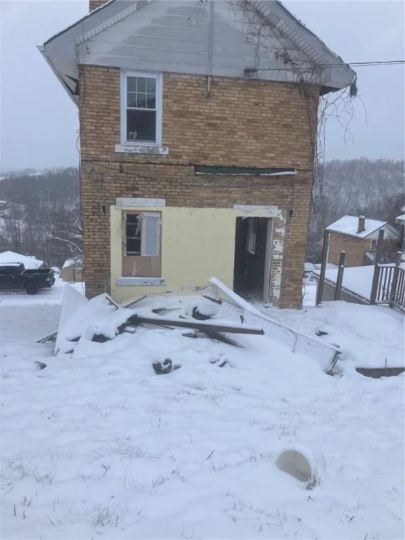 view of snow covered property