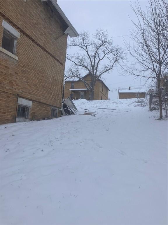 view of yard covered in snow