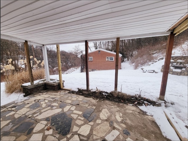 view of snow covered patio