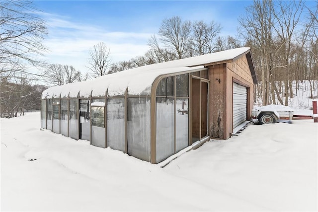 view of snow covered garage