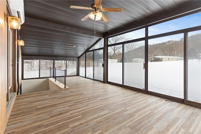 unfurnished sunroom featuring vaulted ceiling and ceiling fan