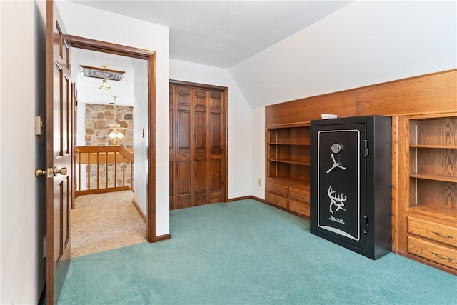 bonus room with carpet floors and lofted ceiling