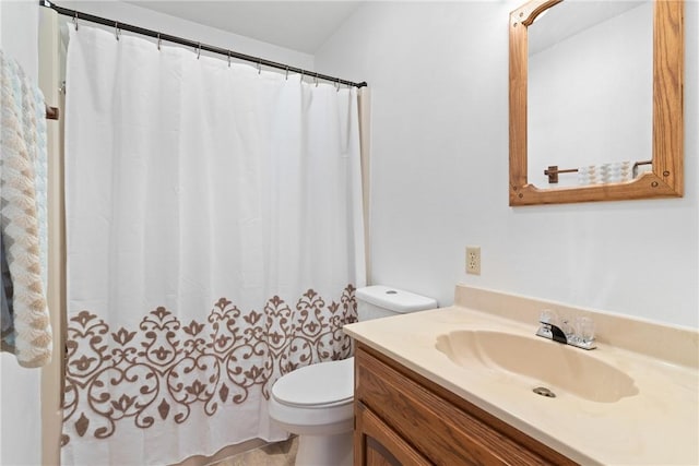 bathroom with toilet and vanity