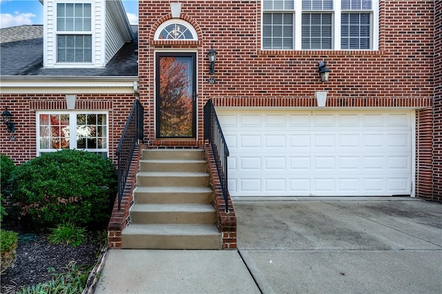 view of exterior entry with a garage