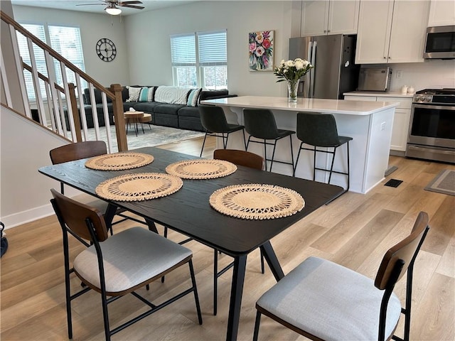 dining room featuring plenty of natural light, light hardwood / wood-style floors, and ceiling fan