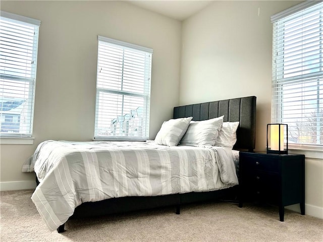 bedroom with light colored carpet