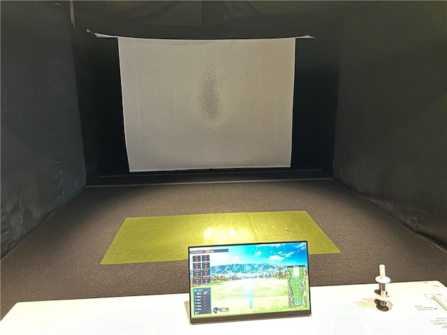 game room with golf simulator