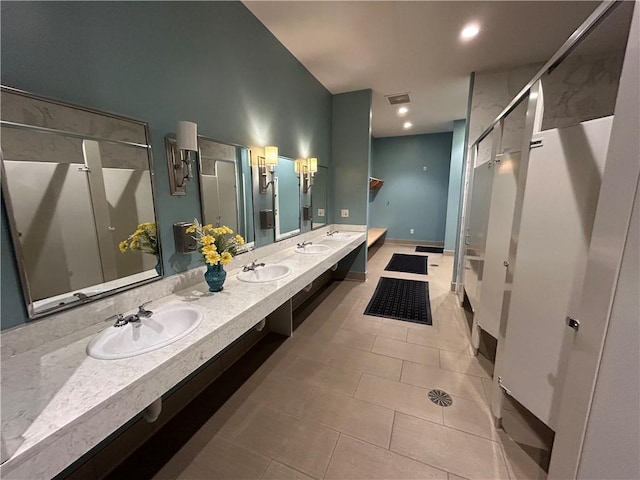 bathroom with tile patterned flooring and vanity