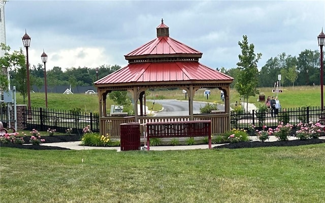 surrounding community featuring a gazebo and a lawn