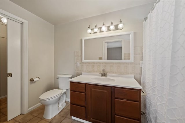 bathroom with tile walls, vanity, tasteful backsplash, tile patterned floors, and toilet