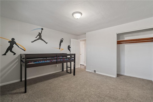 bedroom with carpet and a closet