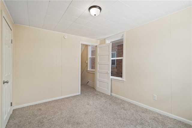 unfurnished bedroom with light colored carpet