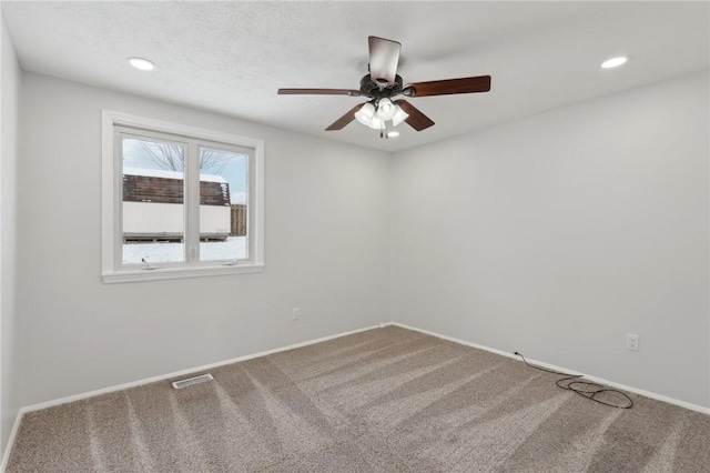 unfurnished room with carpet floors and ceiling fan