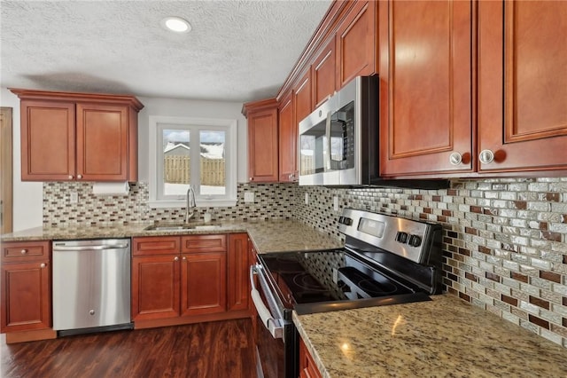 kitchen with sink, stainless steel appliances, dark hardwood / wood-style flooring, and backsplash