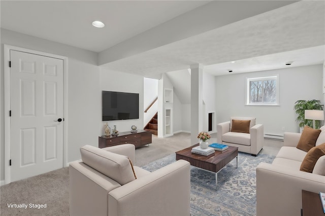 living room featuring a baseboard radiator and light carpet