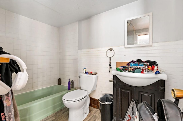 bathroom featuring wood-type flooring, toilet, and vanity