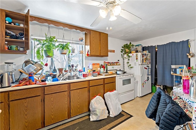 kitchen featuring sink, ceiling fan, and white appliances