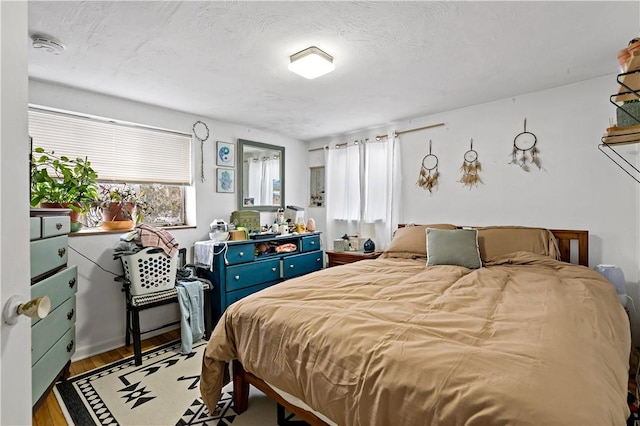 bedroom featuring wood-type flooring