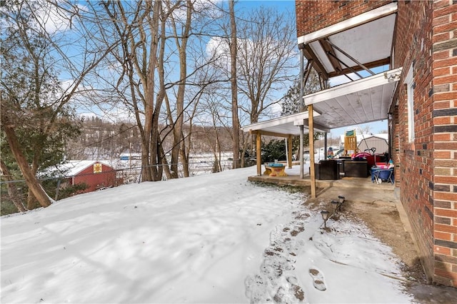 view of yard covered in snow