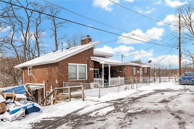 view of snow covered house