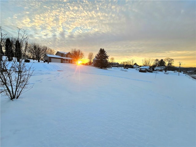 view of yard layered in snow