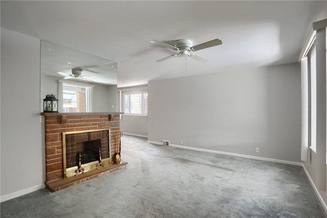 living room featuring ceiling fan, carpet flooring, and a fireplace