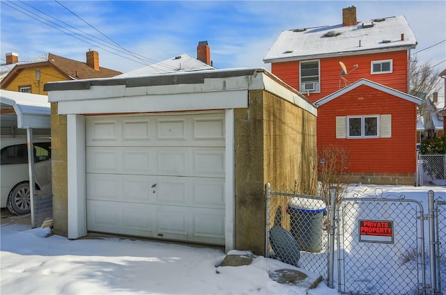 exterior space featuring a garage, an outdoor structure, and central air condition unit