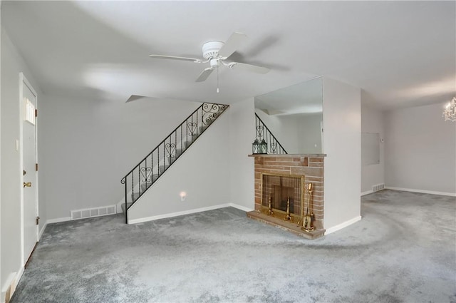 unfurnished living room with a fireplace, carpet floors, and ceiling fan