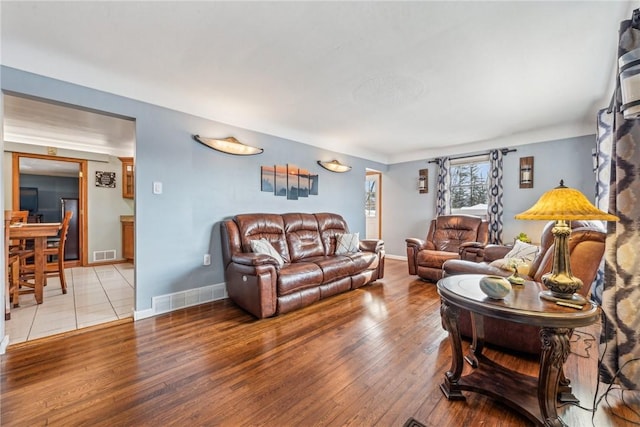 living room with light hardwood / wood-style floors