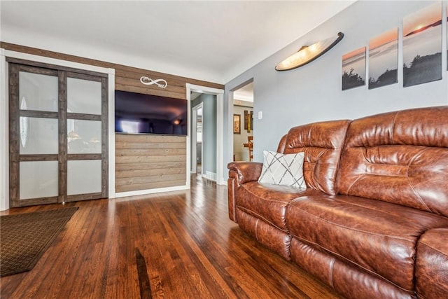 living room with dark hardwood / wood-style flooring