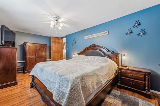 bedroom featuring ceiling fan and hardwood / wood-style floors