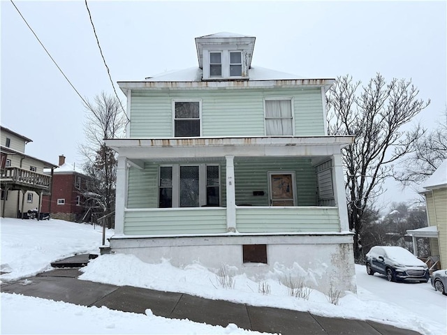 front of property featuring covered porch