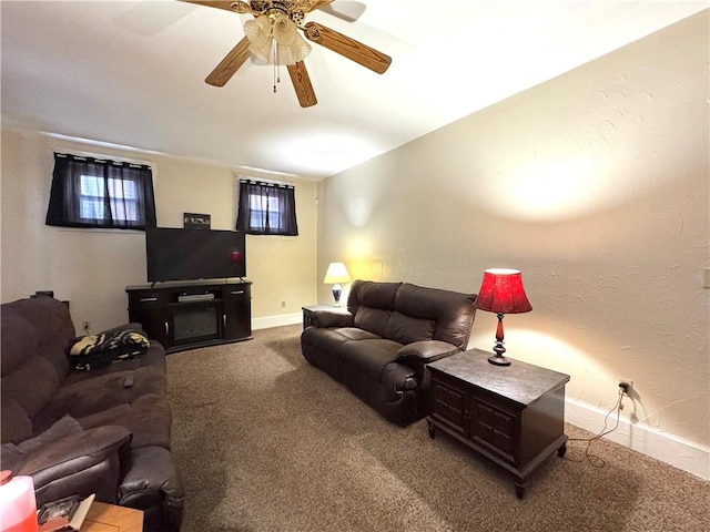 living room featuring carpet floors and ceiling fan