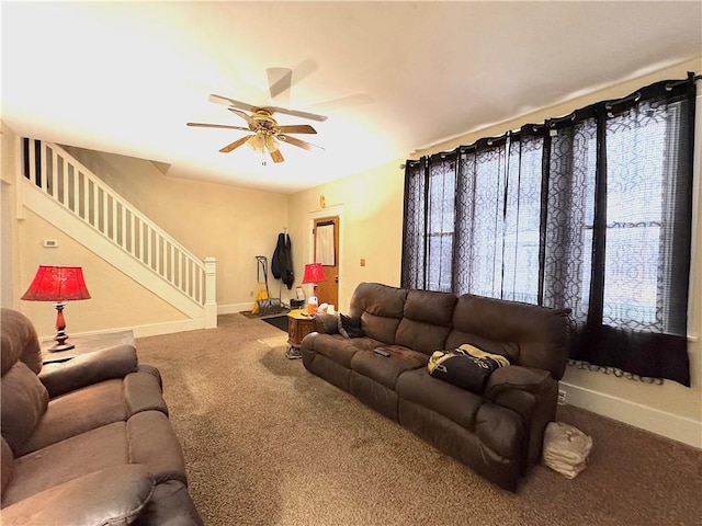 living room with ceiling fan and carpet