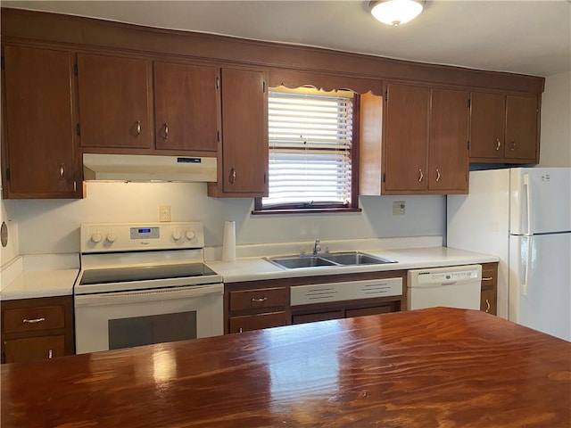 kitchen with sink and white appliances