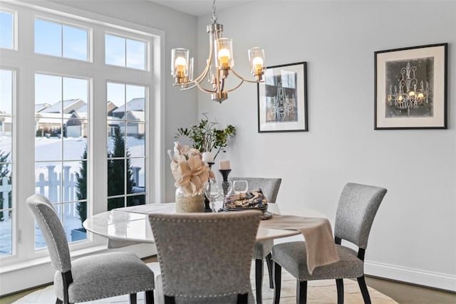 dining area featuring hardwood / wood-style floors and a chandelier