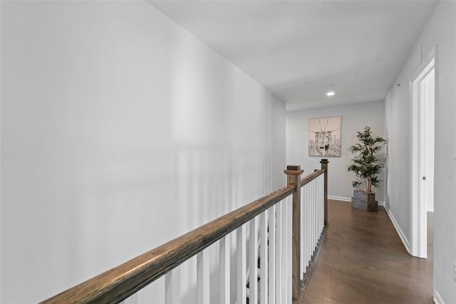 hall with dark hardwood / wood-style flooring