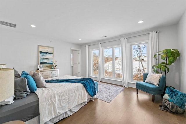 bedroom with hardwood / wood-style floors