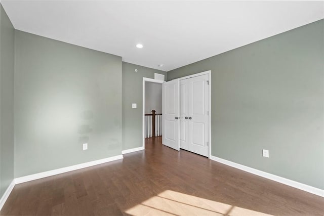 unfurnished bedroom featuring dark hardwood / wood-style floors