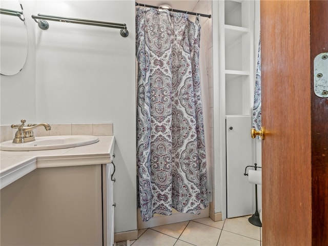 bathroom featuring vanity, a shower with shower curtain, and tile patterned flooring