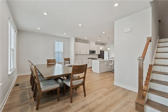 dining room with light hardwood / wood-style floors