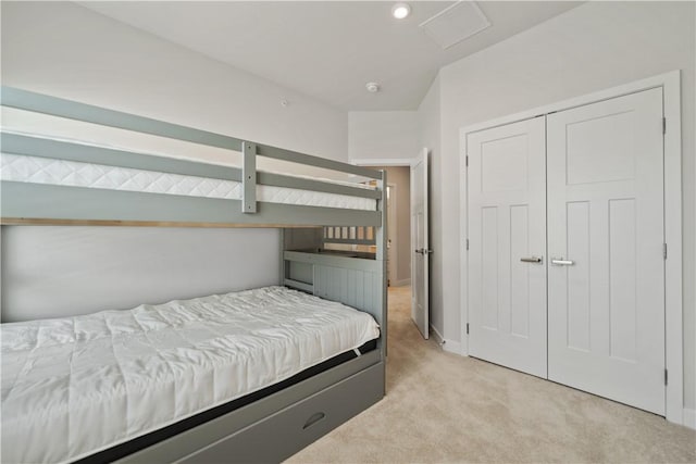 carpeted bedroom featuring a closet