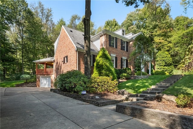 view of home's exterior featuring a yard and a garage