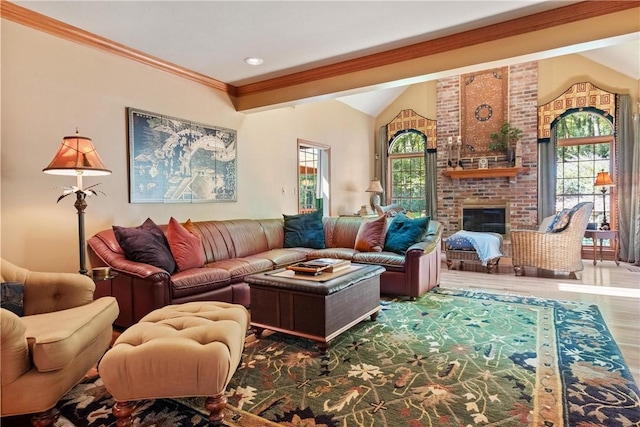 living room featuring a brick fireplace, lofted ceiling, and ornamental molding