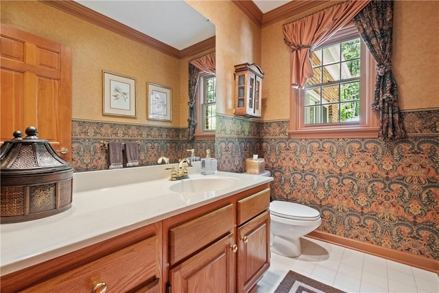 bathroom featuring vanity, toilet, and ornamental molding