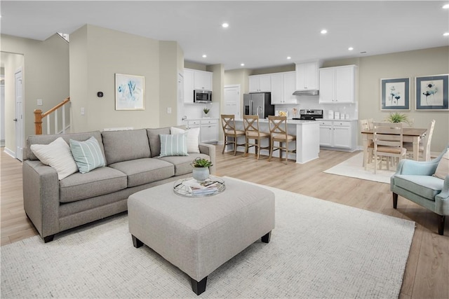 living room with light hardwood / wood-style floors