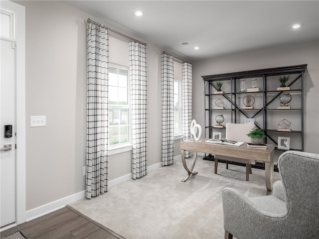 home office with wood-type flooring